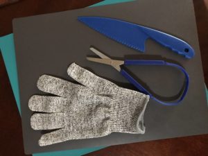 Adaptive cutting boards, safety glove, loop scissors, safety knife