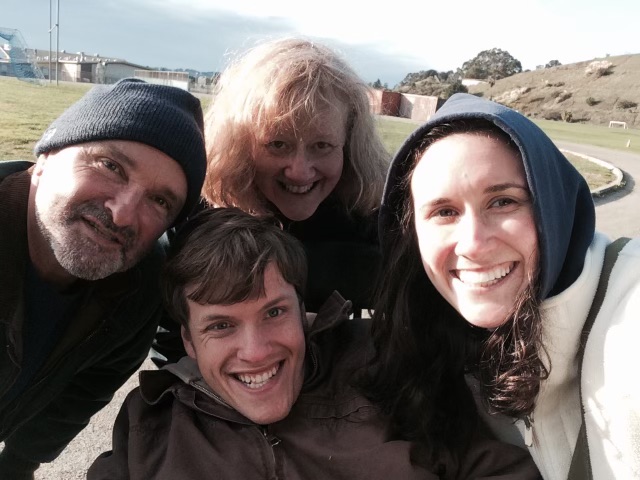 Kyle pictured with his mom, dad, and sister.