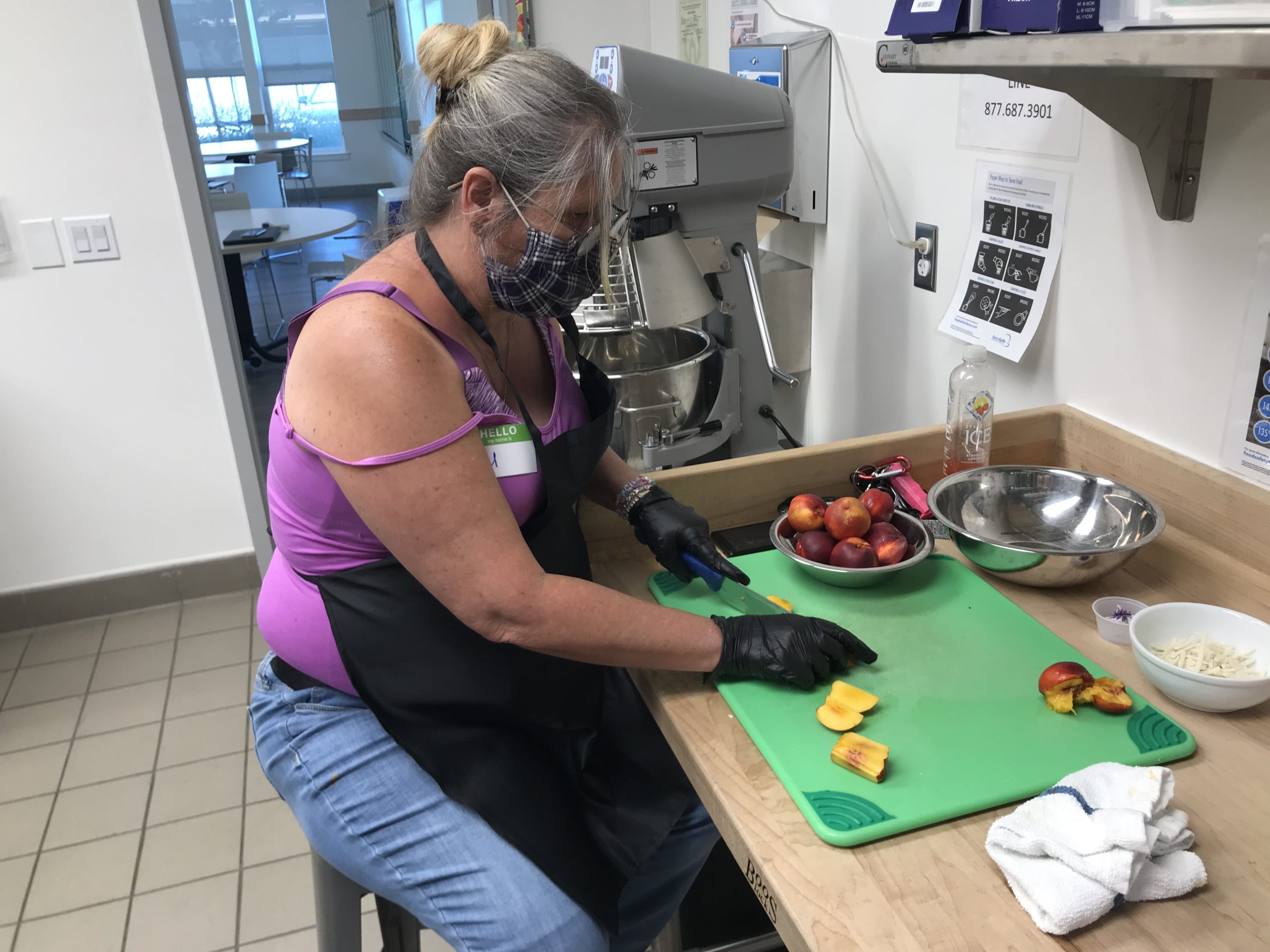 Della chopping fruit in the Irby Ranch kitchen.