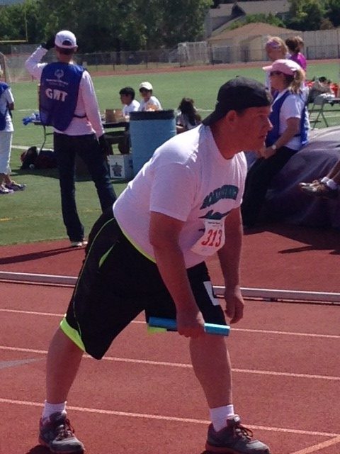 Bruce at starting line of running race for Special Olympics