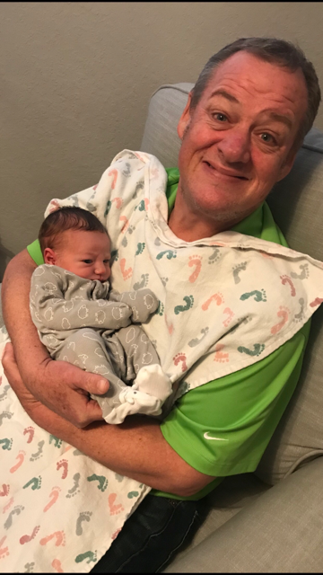 Bruce holding a baby